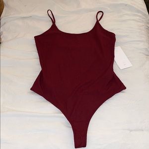 athlete essence strappy bodysuit